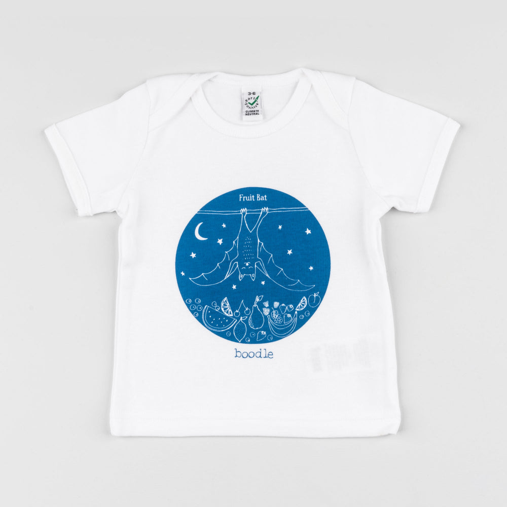 A white short-sleeve baby t-shirt with a blue circular graphic on the chest showing a boodle frog, stars, and a crescent moon, with the text 'Fruit Bat' and 'boodle'.