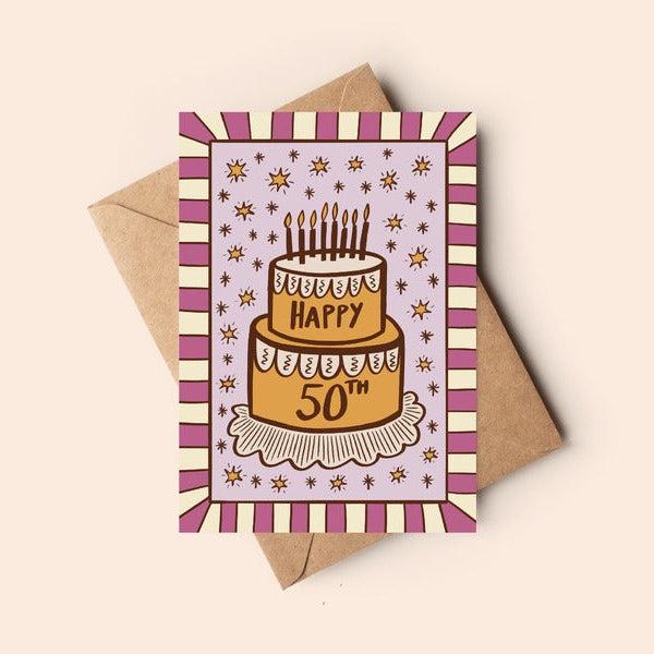 Birthday card with cake illustration and 'Happy 50th' text on a striped background, with a brown envelope.
