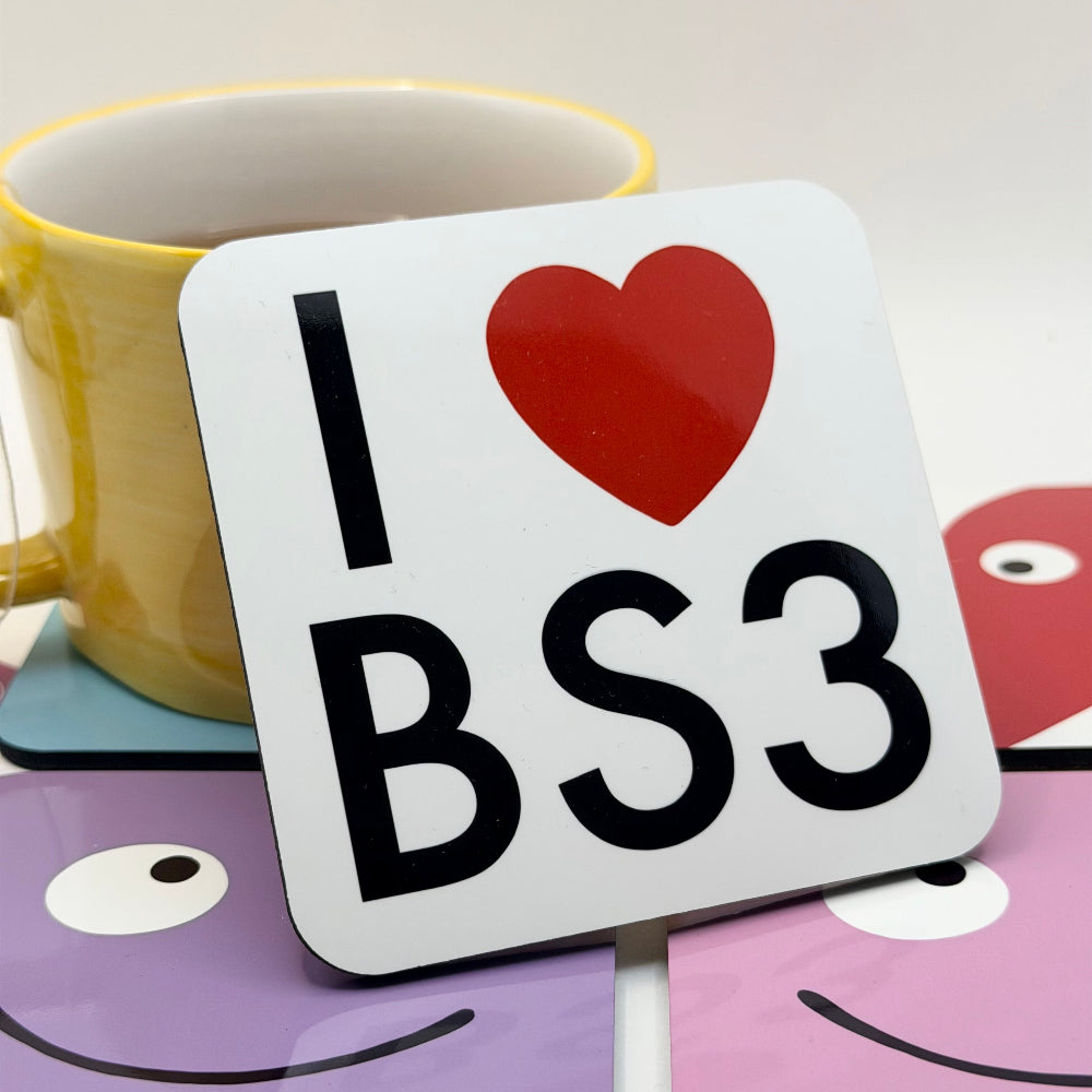 Coasters with 'I ❤️ BS3' design on a white surface