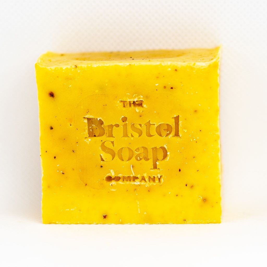 Yellow soap bar with 'The Bristol Soap Company' branding on a white background