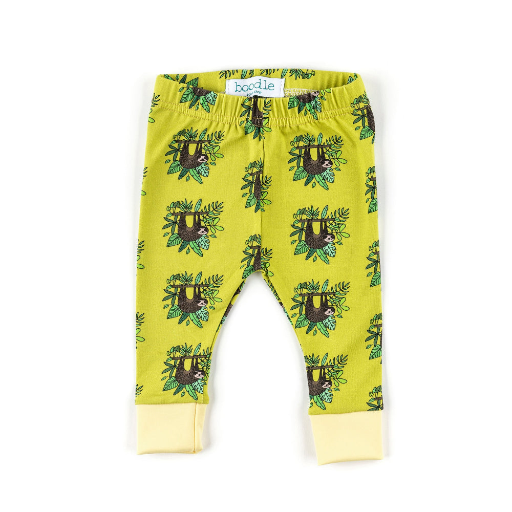 A pair of toddler leggings in a bright yellow-green color, featuring an all-over print of brown sloths hanging from green vines. The leggings have a matching elastic waistband and light yellow ribbed ankle cuffs.