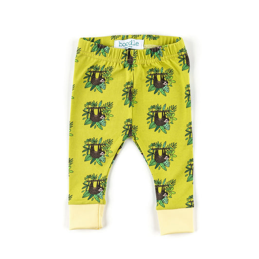 A pair of toddler leggings in a bright yellow-green color, featuring an all-over print of brown sloths hanging from green vines. The leggings have a matching elastic waistband and light yellow ribbed ankle cuffs.
